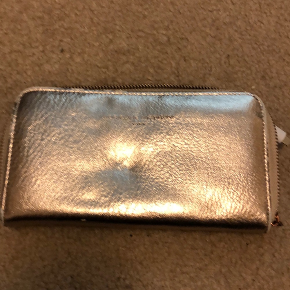 Rose gold wallet with a charging block